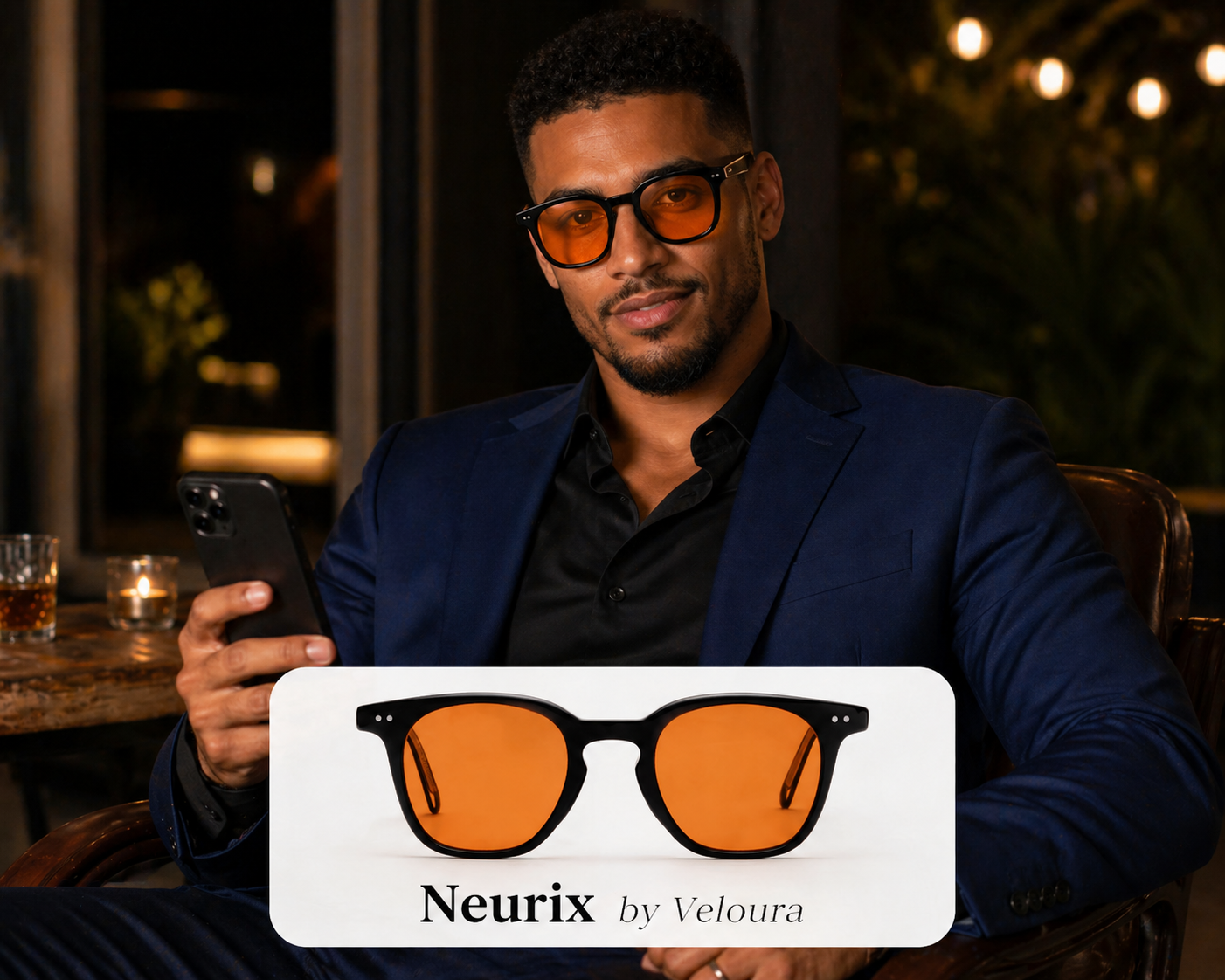 Man in navy suit holding NEURIX™ by Veloura premium eyewear at evening venue.